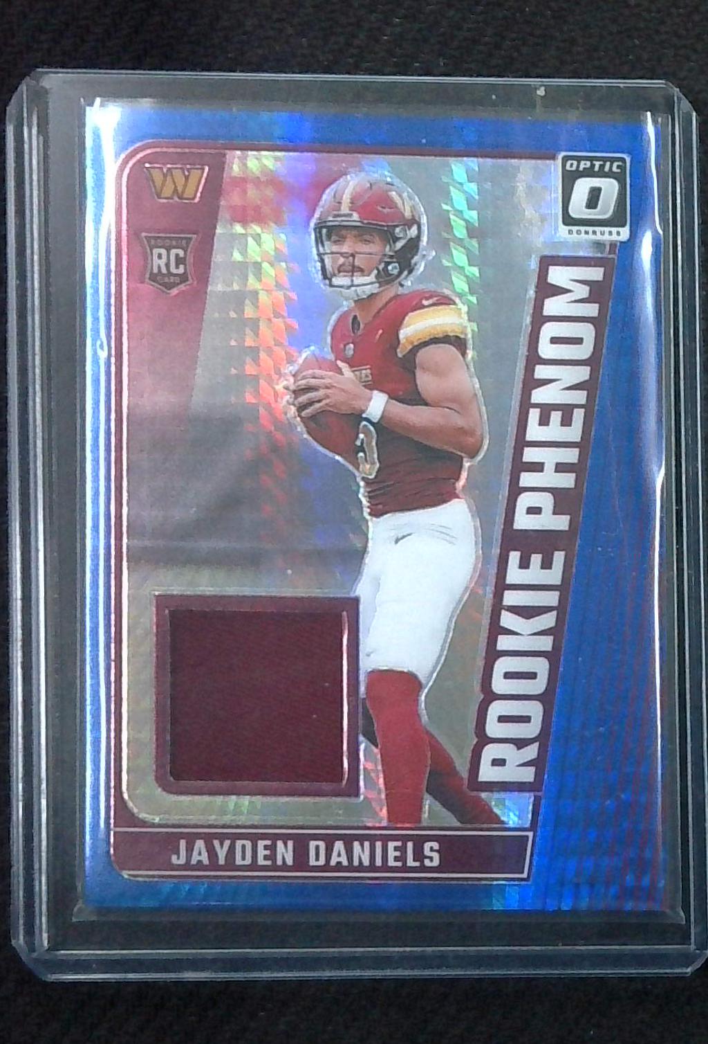 2024 OPTIC JAYDEN DANIELS RC HYPER BLUE PRIZM ROOKIE PHENOM RELIC RPB-JDS