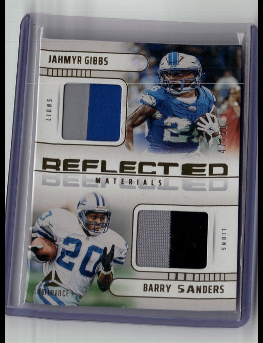 2025 Panini Luminance Barry Sanders Jahmyr Gibbs Reflected Jersey Gold #/50