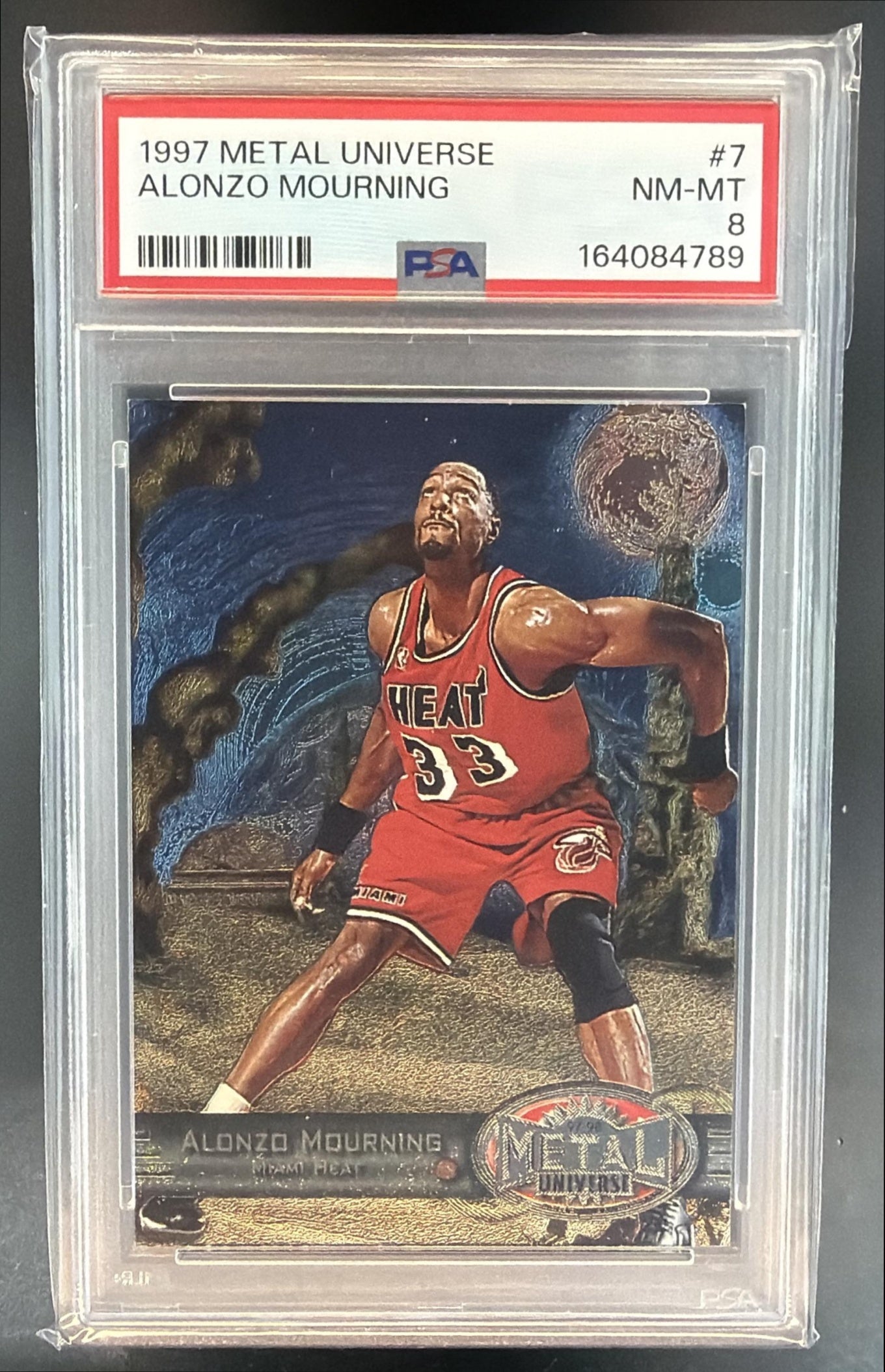 1997-98 Skybox Metal Universe Alonzo Mourning #7 Heat PSA 8 — front